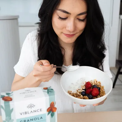 girl is having breakfast pecan granola